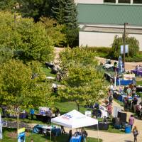 Arial shot of event containing employer booths and gvsu clock tower